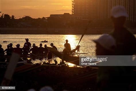 623008250|Boat crew members train on the waters of the Tonle Sap River on。